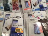 a lot of cell phones that are sitting on a table