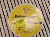 a close up of a paper plate with a crown on it