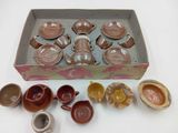 a box with a bunch of cups and saucers in it