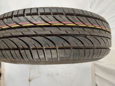 a close up of a tire on a white surface