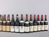 several bottles of wine are lined up on a table
