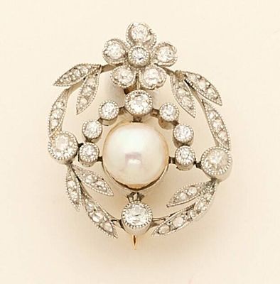 an image of a pearl and diamond broochle