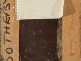 an old picture of a piece of cardboard with a piece of paper attached to it
