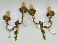 Paire d'appliques en bronze doré et pampilles.