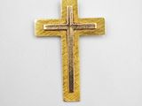 gold plated cross pendant on a white background