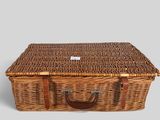 an image of a wicker picnic basket with a handle