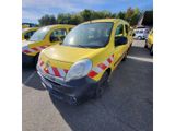 two yellow vans parked next to each other in a parking lot