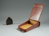 a small brown box with a wooden lid and a small wooden box with a wooden lid