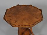 a small table with a wooden top and a wooden base