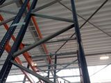 a large metal rack in the middle of a warehouse