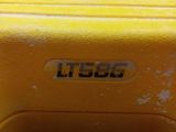 a yellow suitcase that is sitting on the ground
