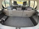 a trunk of a car with the seats folded down