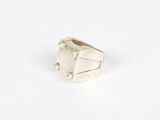 a close up of a silver ring on a white surface