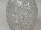 a glass vase that is sitting on a table
