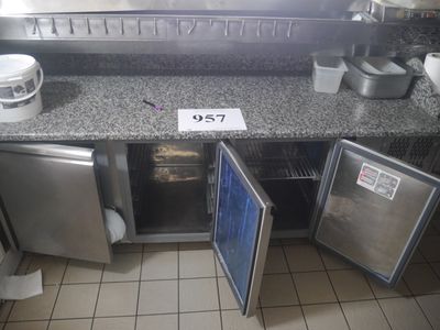 an image of a commercial kitchen with a lot of counter space