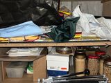 a shelf with many items on it in a room