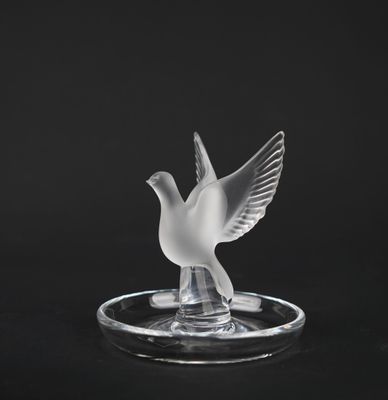 crystal dove figurine on a black background