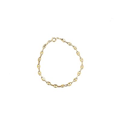 a gold chain bracelet with a link on a white background