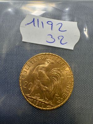a gold sovereign coin with a label on it