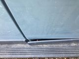 a close up view of a car ' s windshield with a hole in it
