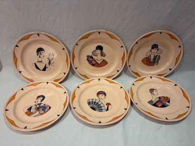 six plates with a picture of a man and a woman on them