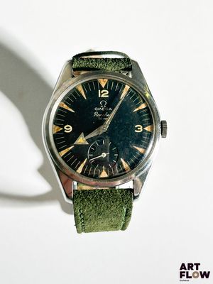 a watch that is sitting on a white surface