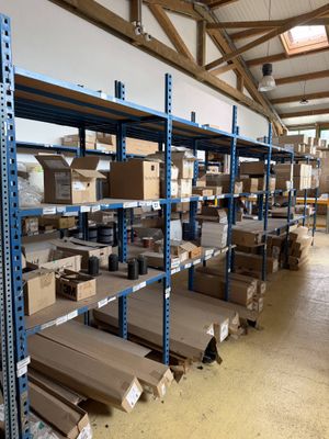 many boxes and boxes on the shelves in the warehouse