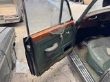 a car that has a door open and a seat in it