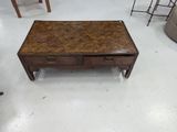an image of a coffee table with drawers in a room