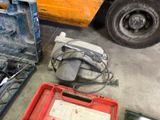 many tools that are sitting on the floor next to a truck