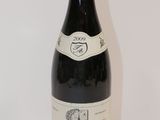 a bottle of wine that is sitting on a table