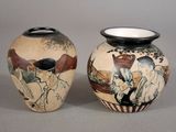 two vases sitting side by side on a table