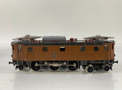 a toy train on a white surface with a white background