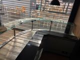 a glass counter in the corner of a restaurant