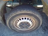 a close up of a flat tire on a truck