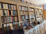 many books on the bookshelves in this room