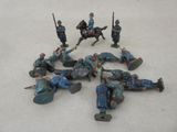 a group of toy soldiers laying on the ground
