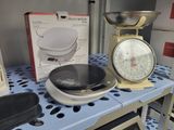a scale and a bowl on a shelf in a store