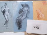 three drawings of a woman and a man on a table