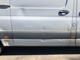 an image of a silver van parked in a parking lot