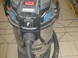a vacuum that is sitting on a tiled floor