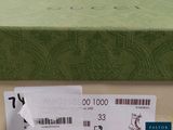 a green box with a white tag on it and a brown box with a white tag on it