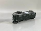 a toy train that is sitting on a white surface