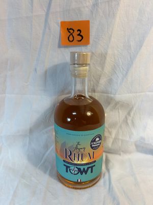 a bottle of liquor sitting on a table with a price tag on it