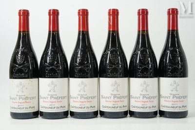 six bottles of red wine lined up in a row on a white surface
