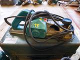 a green machine that is sitting on top of a table
