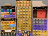 several cardboard boxes are stacked on top of each other on a table