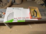 a box of scissors and a pair of scissors on a table