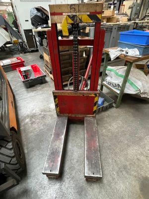 a fork lift truck that is parked in a garage