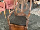 a chair that is sitting in the middle of a room
